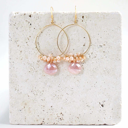Close-up of Peach Moonstone Swing Earrings with 14k gold plated lightweight hoops and French hooks
