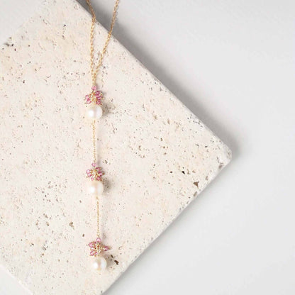 Pearl and Aquamarine Quartz NecklaceY design with 3 white freshwater bead pearls paired with genuine aquamarine quartz  gemstones.
Handmade necklace is 18" long with a 2" extender (up to 20") and 14k gNecklacesPARKEN JEWELRYVettedArcPearl And Aquamarine Quartz Necklace