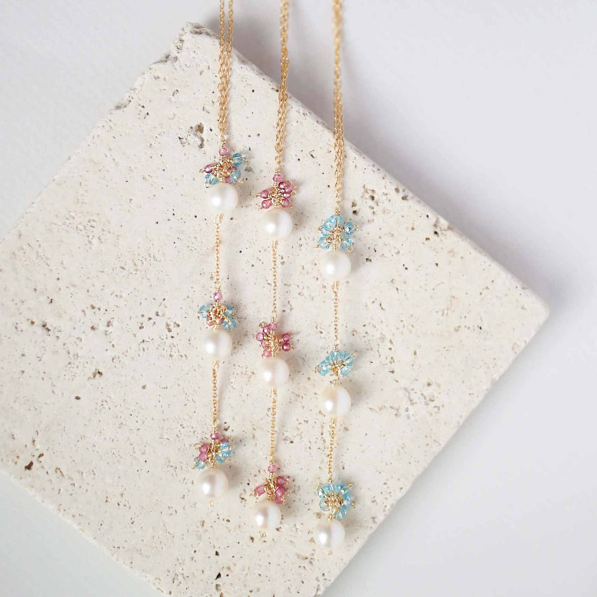 Pearl and Aquamarine Quartz NecklaceY design with 3 white freshwater bead pearls paired with genuine aquamarine quartz  gemstones.
Handmade necklace is 18" long with a 2" extender (up to 20") and 14k gNecklacesPARKEN JEWELRYVettedArcPearl And Aquamarine Quartz Necklace