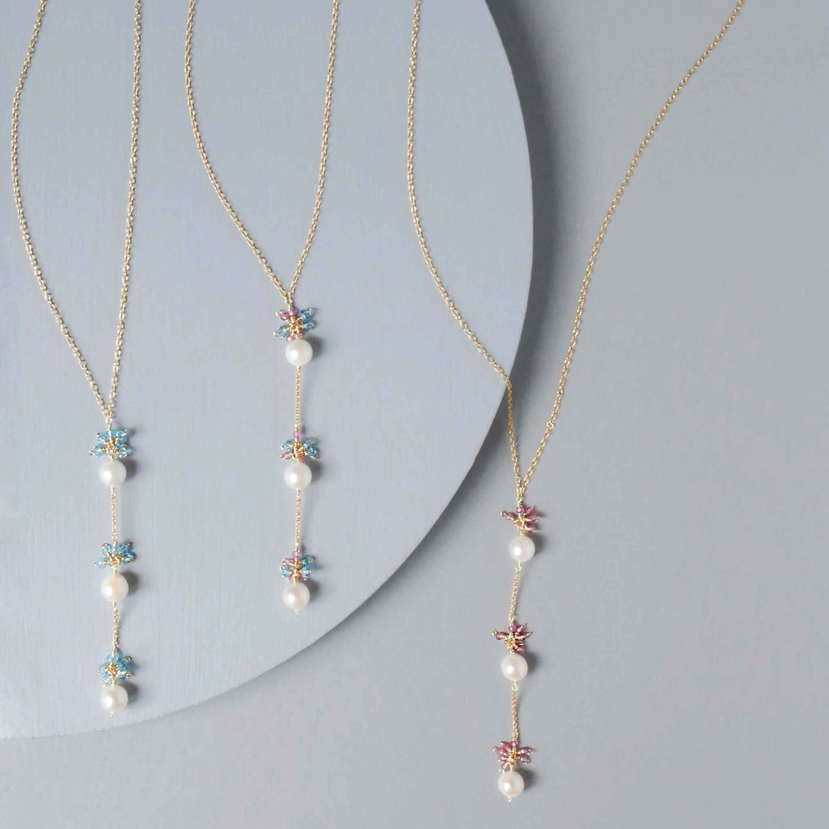 Pearl and Aquamarine Quartz NecklaceY design with 3 white freshwater bead pearls paired with genuine aquamarine quartz  gemstones.
Handmade necklace is 18" long with a 2" extender (up to 20") and 14k gNecklacesPARKEN JEWELRYVettedArcPearl And Aquamarine Quartz Necklace