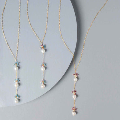 Pearl and Aquamarine Quartz NecklaceY design with 3 white freshwater bead pearls paired with genuine aquamarine quartz  gemstones.
Handmade necklace is 18" long with a 2" extender (up to 20") and 14k gNecklacesPARKEN JEWELRYVettedArcPearl And Aquamarine Quartz Necklace