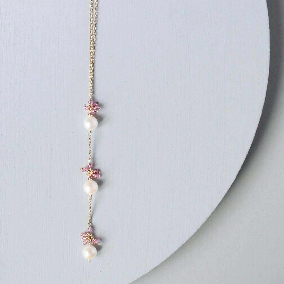 Pearl and Aquamarine Quartz NecklaceY design with 3 white freshwater bead pearls paired with genuine aquamarine quartz  gemstones.
Handmade necklace is 18" long with a 2" extender (up to 20") and 14k gNecklacesPARKEN JEWELRYVettedArcPearl And Aquamarine Quartz Necklace