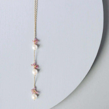 Pearl and Aquamarine Quartz NecklaceY design with 3 white freshwater bead pearls paired with genuine aquamarine quartz  gemstones.
Handmade necklace is 18" long with a 2" extender (up to 20") and 14k gNecklacesPARKEN JEWELRYVettedArcPearl And Aquamarine Quartz Necklace
