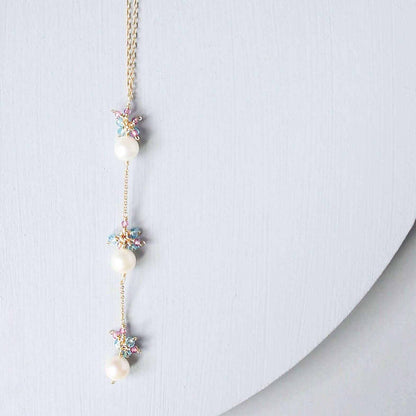 Pearl and Aquamarine Quartz NecklaceY design with 3 white freshwater bead pearls paired with genuine aquamarine quartz  gemstones.
Handmade necklace is 18" long with a 2" extender (up to 20") and 14k gNecklacesPARKEN JEWELRYVettedArcPearl And Aquamarine Quartz Necklace