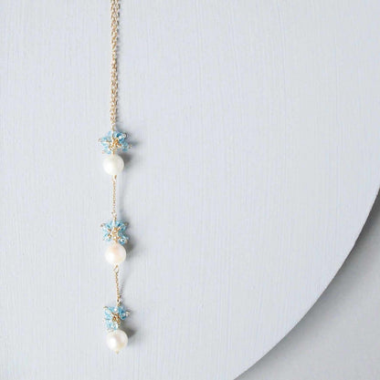 Pearl and Aquamarine Quartz NecklaceY design with 3 white freshwater bead pearls paired with genuine aquamarine quartz  gemstones.
Handmade necklace is 18" long with a 2" extender (up to 20") and 14k gNecklacesPARKEN JEWELRYVettedArcPearl And Aquamarine Quartz Necklace