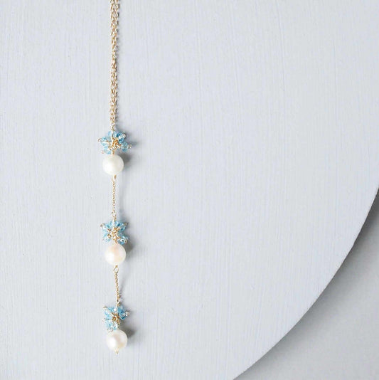 Pearl and Aquamarine Quartz NecklaceY design with 3 white freshwater bead pearls paired with genuine aquamarine quartz  gemstones.
Handmade necklace is 18" long with a 2" extender (up to 20") and 14k gNecklacesPARKEN JEWELRYVettedArcPearl And Aquamarine Quartz Necklace