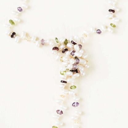 Pearl and gemstone ballet lariat necklace with freshwater pearls and multicolored gemstones on white background