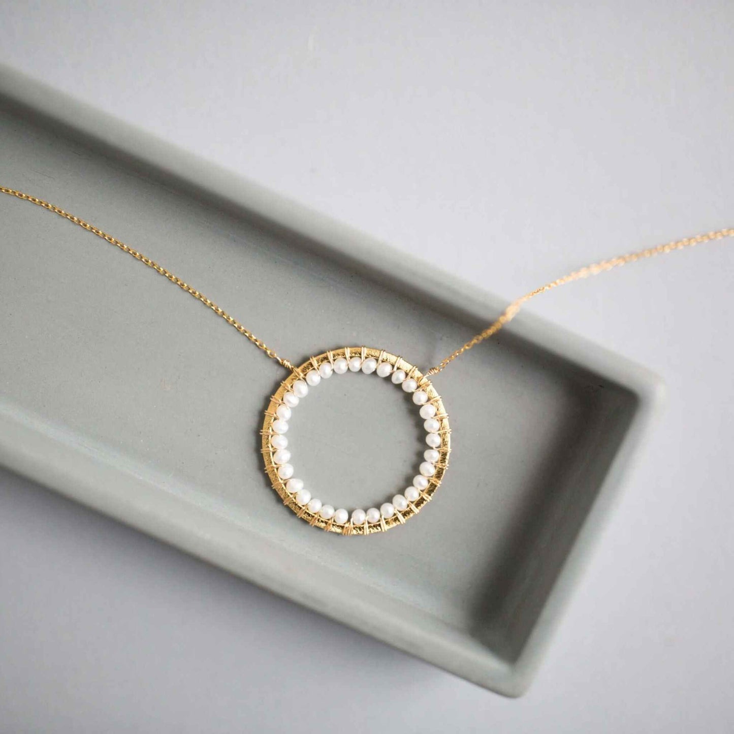 Pearl Halo Necklace with lustrous pearls and 14k gold plated chain in floating pendant design