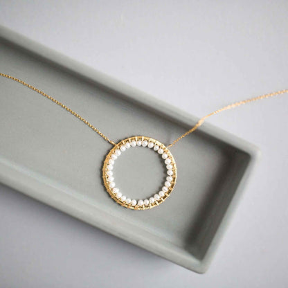 Pearl Halo Necklace with lustrous pearls and 14k gold plated chain in floating pendant design