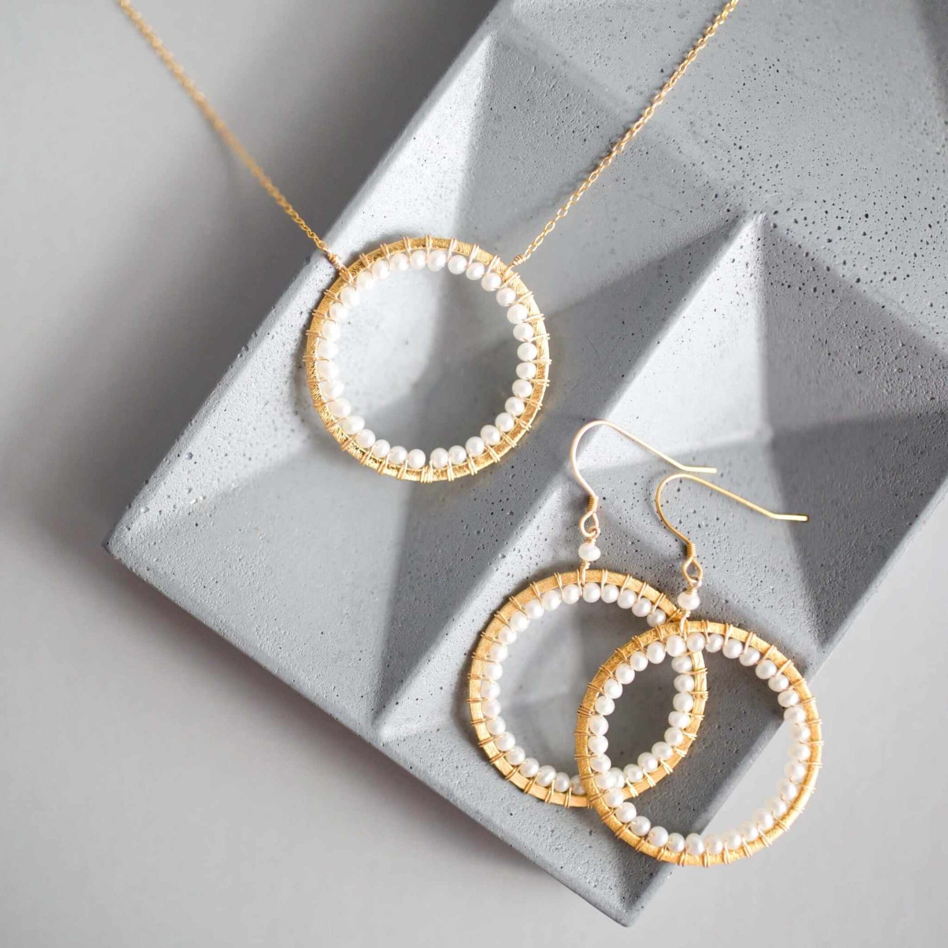 Pearl Halo Necklace with lustrous pearls on adjustable 14k gold plated chain in floating pendant design