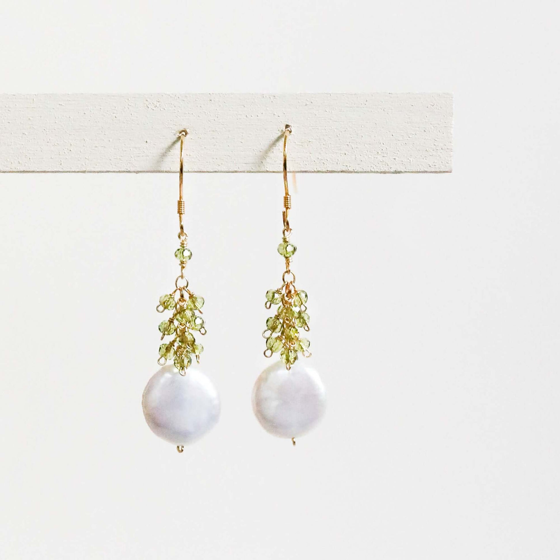 Peridot coin pearl earrings with freshwater pearls and peridot gemstones, 1.25" long, 14k gold plated sterling silver, French hooks, handmade in NYC.