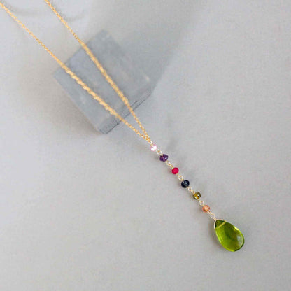 Peridot green quartz yoga pendant necklace in gold with multicolor accent stones