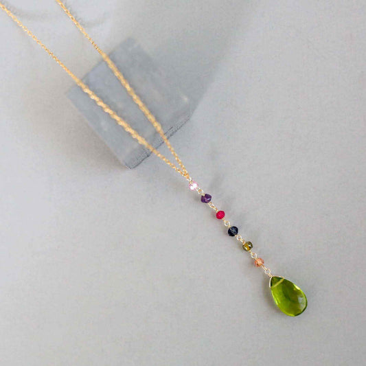 Peridot green quartz yoga pendant necklace in gold with multicolor accent stones