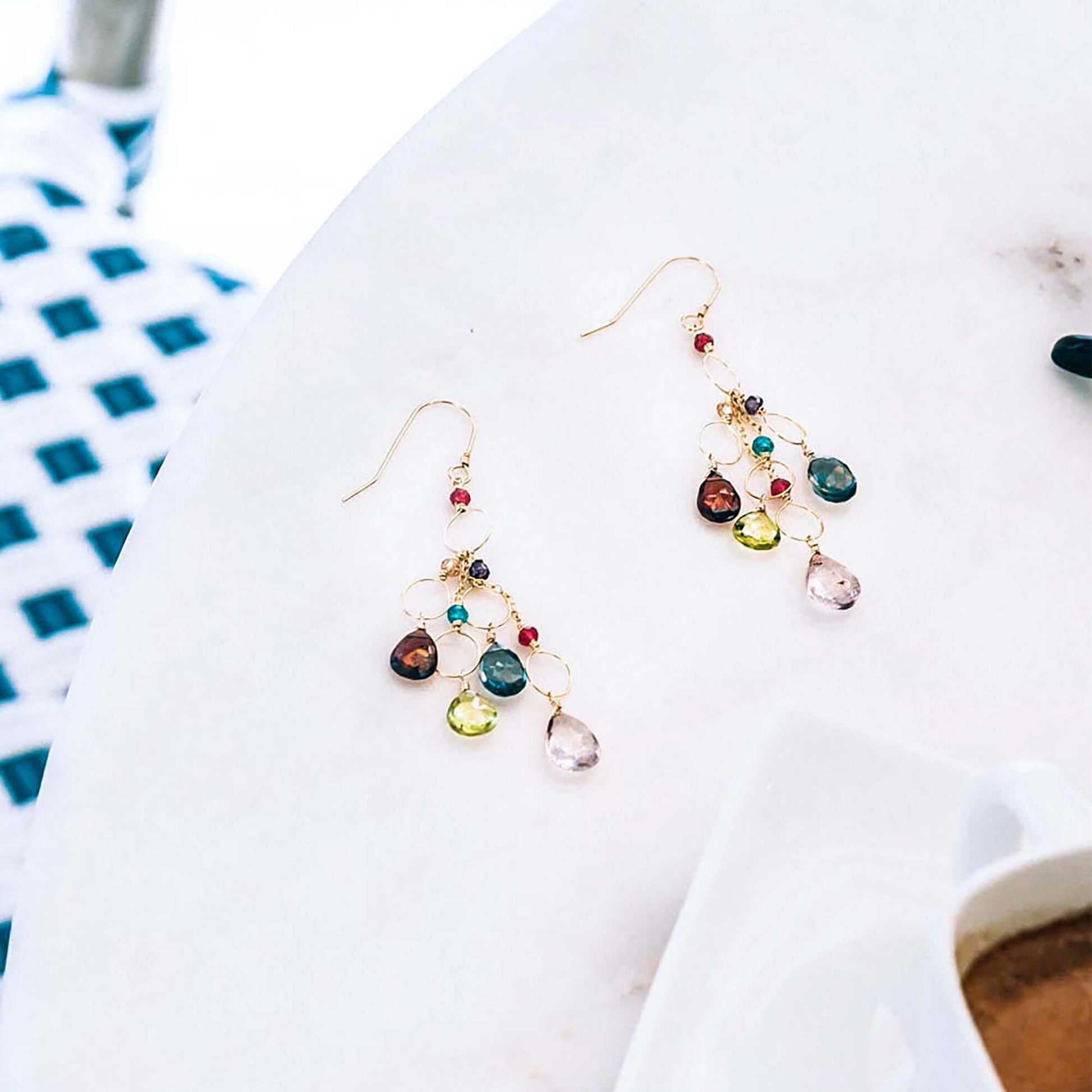 Rainbow Gemstone Waterfall Earrings with pink quartz, iolite, peridot, and garnet gemstones on gold plated sterling silver French hooks.