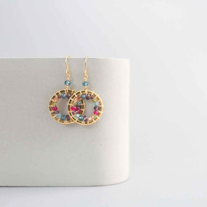 Close-up of Rainbow Halo Mini Earrings with multicolored gems and 14k gold plating on silver