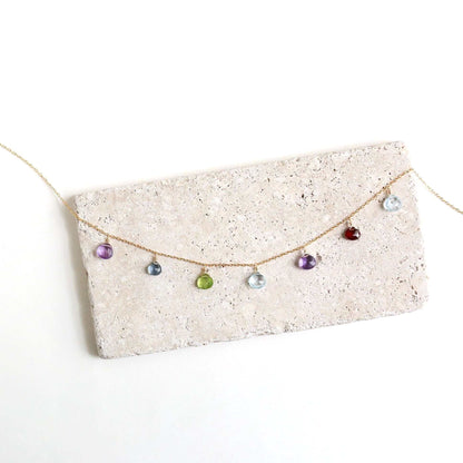 Gold Rainbow Sparkler Necklace with aquamarine, garnet, iolite, amethyst, and peridot gemstones on 14k gold plated sterling silver chain
