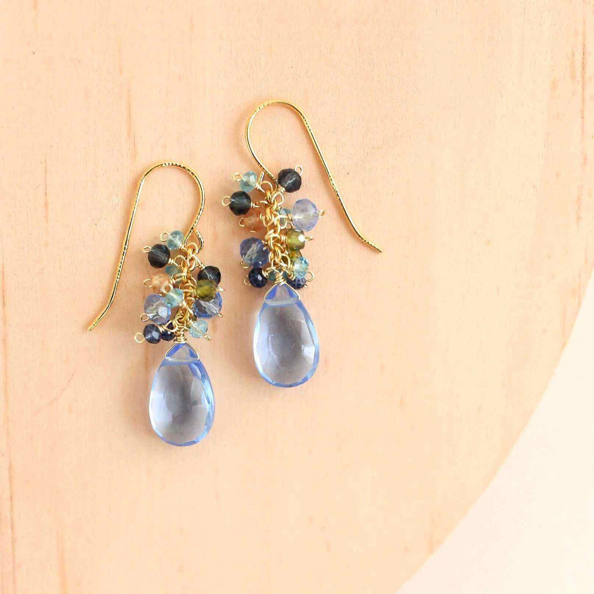 Sky Blue Quartz Bala EarringsStunning drops of color. Gold drop earrings made with sky blue quartz topped with a blue cluster of gems.
- 1.25" long- French hooks- 14k gold plated .925 fine ItaliEarringsPARKEN JEWELRYVettedArcSky Blue Quartz