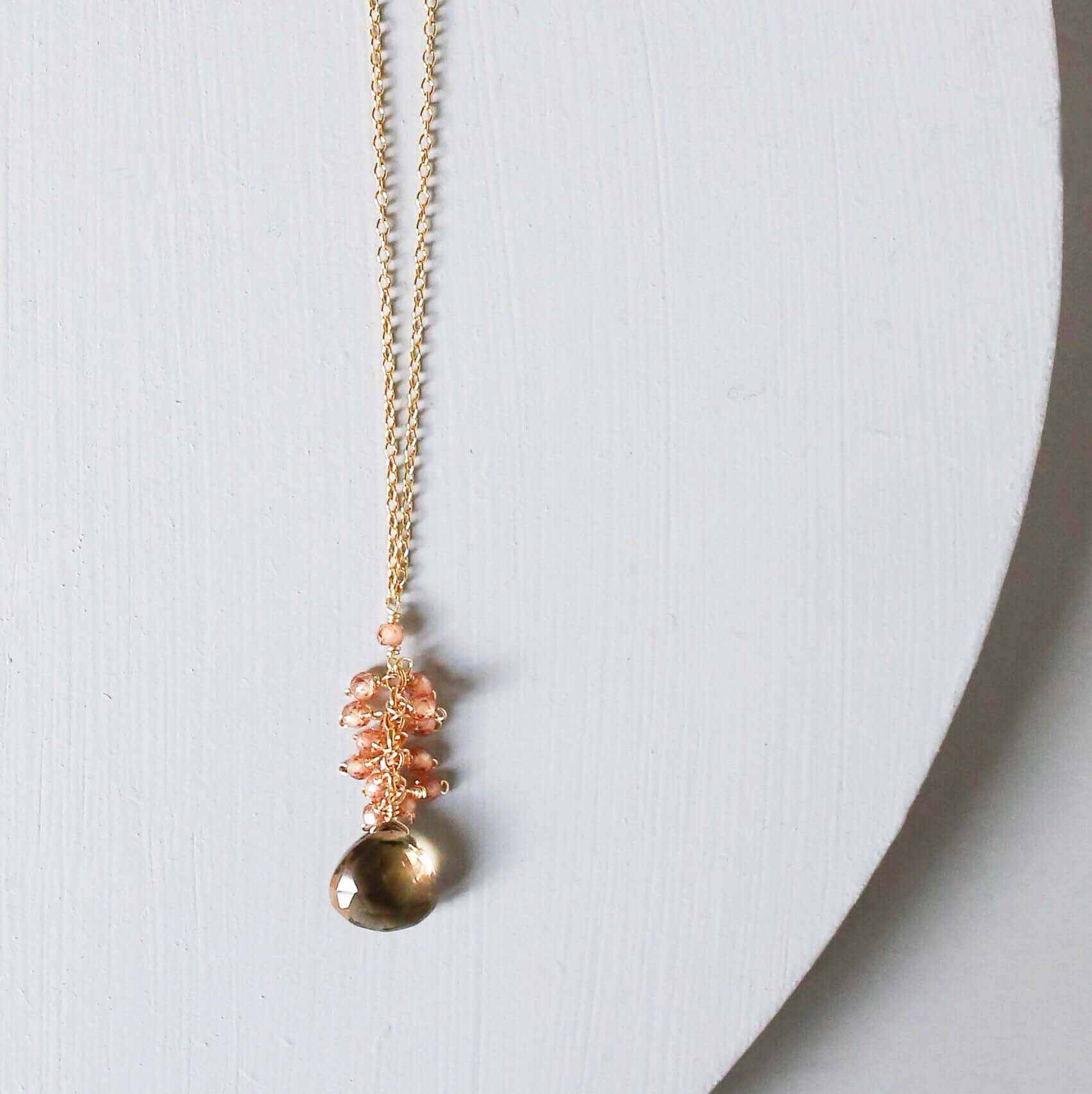 Smoky Quartz Cluster Necklace featuring floating smoky quartz and mini champagne quartz gems on gold plated sterling silver chain