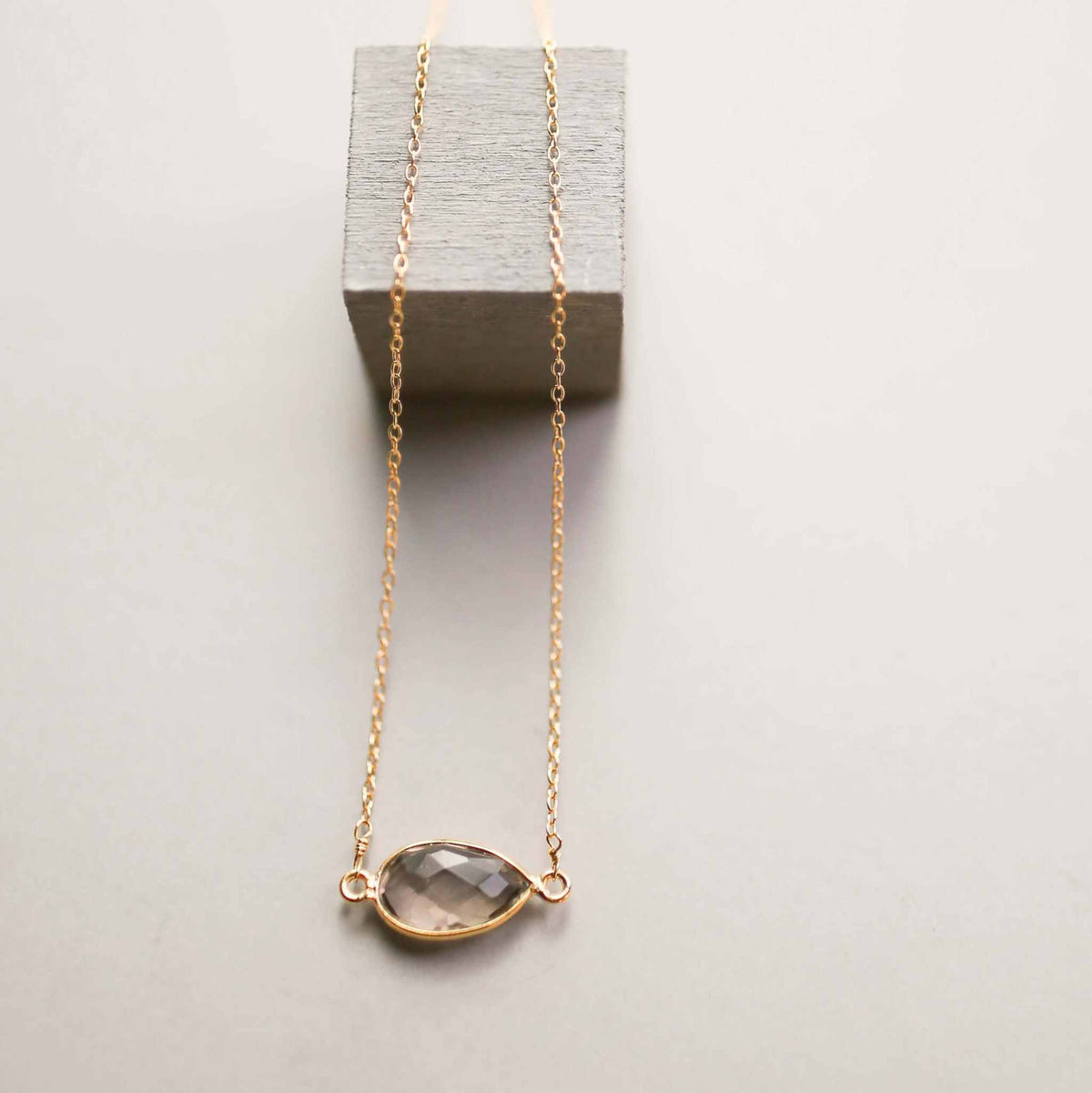 Smoky quartz gold minimalist necklace with bezel set stone on delicate gold chain