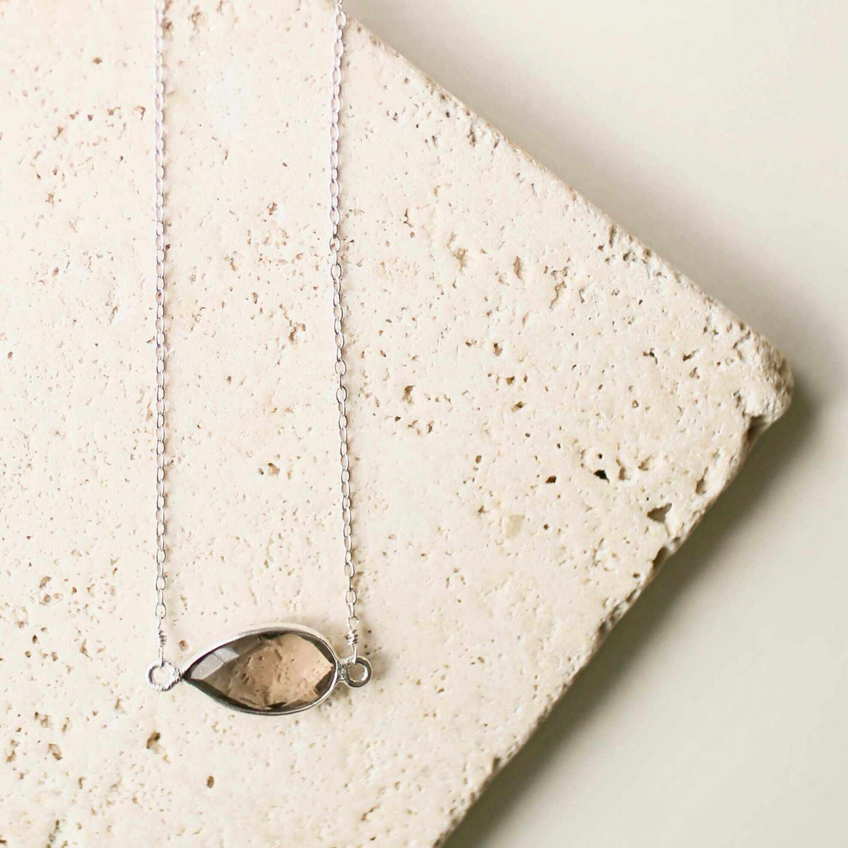 Minimalist silver necklace with smoky quartz pendant on delicate chain