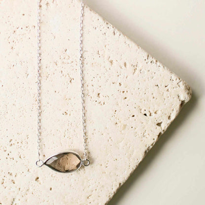 Minimalist silver necklace with smoky quartz pendant on delicate chain