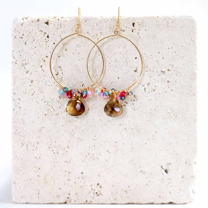 Delicate smoky quartz swing earrings with 14k gold plated sterling silver hoops and French hooks.