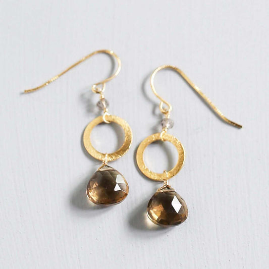 The Airie Earring smoky quartz gold 1.5-inch French hook earrings on a white background