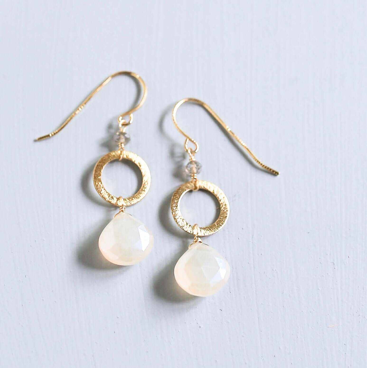 The Airie Earring featuring white chalcedony gemstones with rhodium plated sterling silver and French hooks