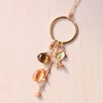 The Ammil Necklace with citrine and smoky quartz strands on a gold hoop, 14k gold plated sterling silver, handmade in NYC
