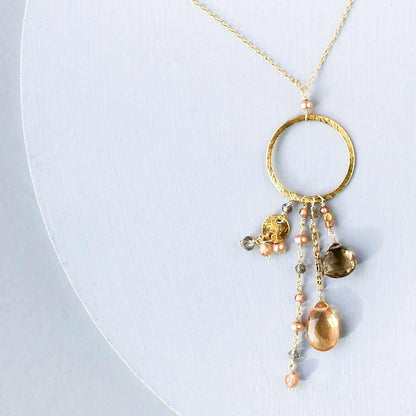 The Ammil Necklace featuring citrine and smoky quartz strands on gold hoop with 14k gold plated sterling silver and spring ring clasp