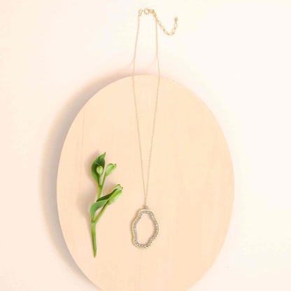 Labradorite Freestyle Pendant Necklace with unique gold pendant and delicate chain