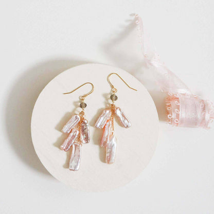White stick pearl earrings with cascading freshwater pearls and black spinel accent on gold plated sterling silver French hooks