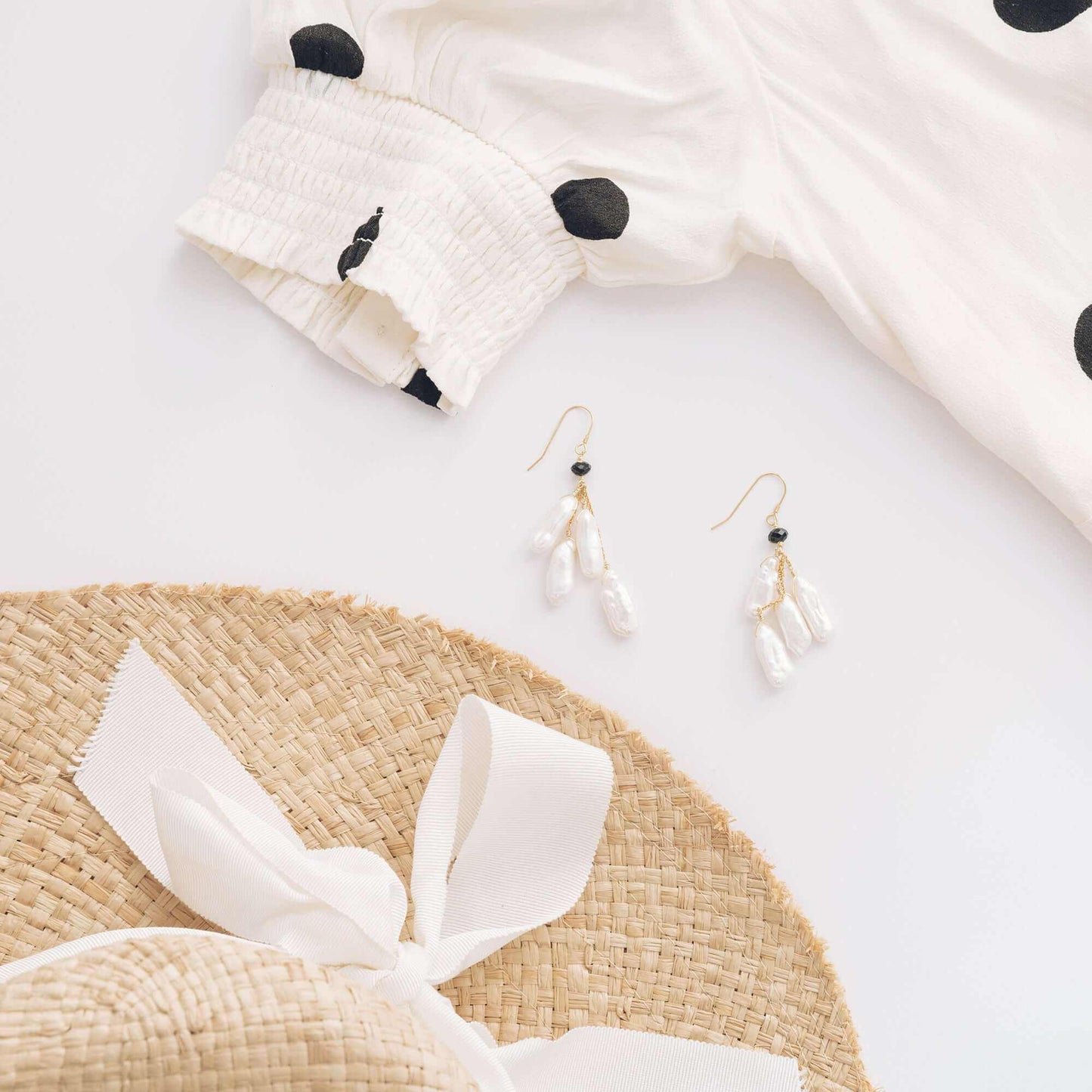 White stick pearl earrings with freshwater pearls and black spinel accents on gold plated sterling silver French hooks