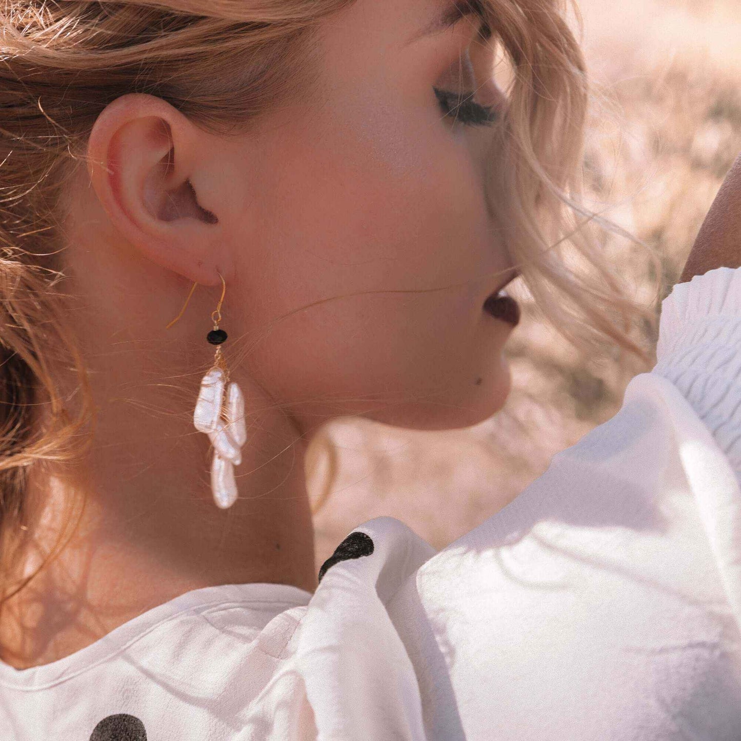 White stick pearl earrings with cascading freshwater pearls and black spinel on 14k gold plated sterling silver French hooks